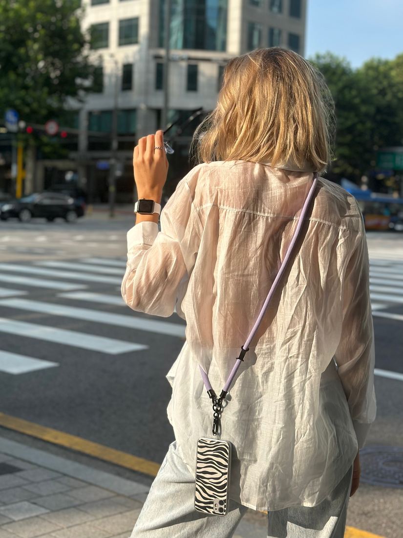 Lilac lanyard on a city street