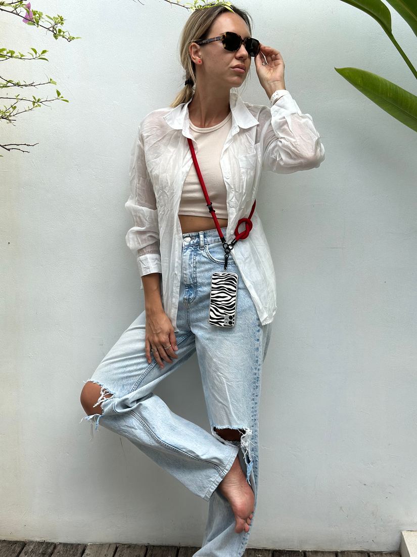 Red lanyard worn across the body